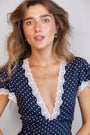model wears Ginkgo Leaf Gold Earrings and ginkgo gold leaf necklace