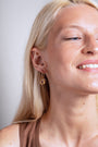 model wears Amethyst Gold Lichen Hoop Earrings
