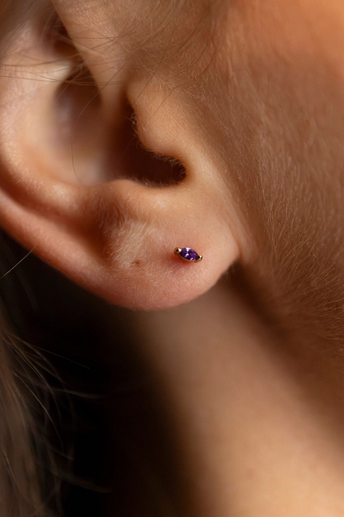 model wears Amethyst Cubic Zirconia Gold Labret Earring