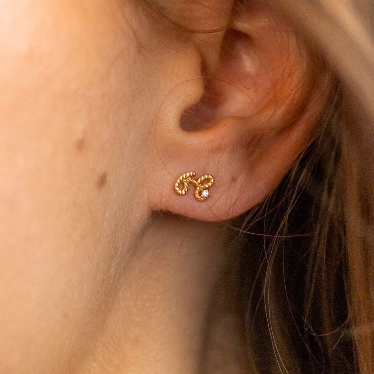 model wears Beautiful Gold Shorthand Stud Earring