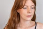 model wears Ridged Chunky Gold Huggie Hoops