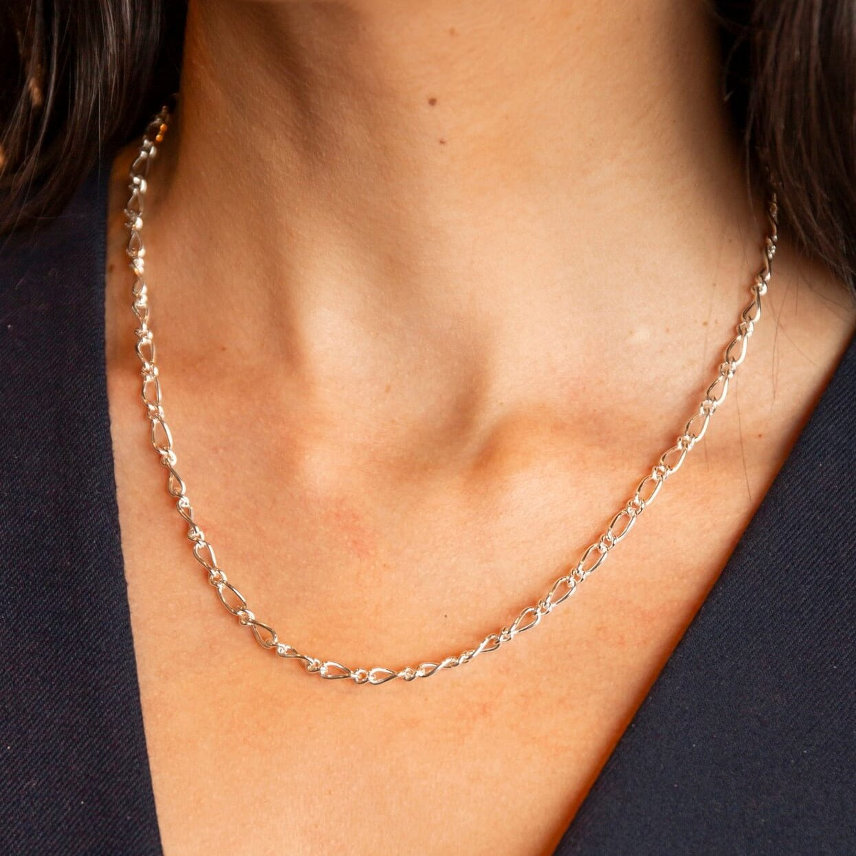 model wears silver chunky figaro chain necklace