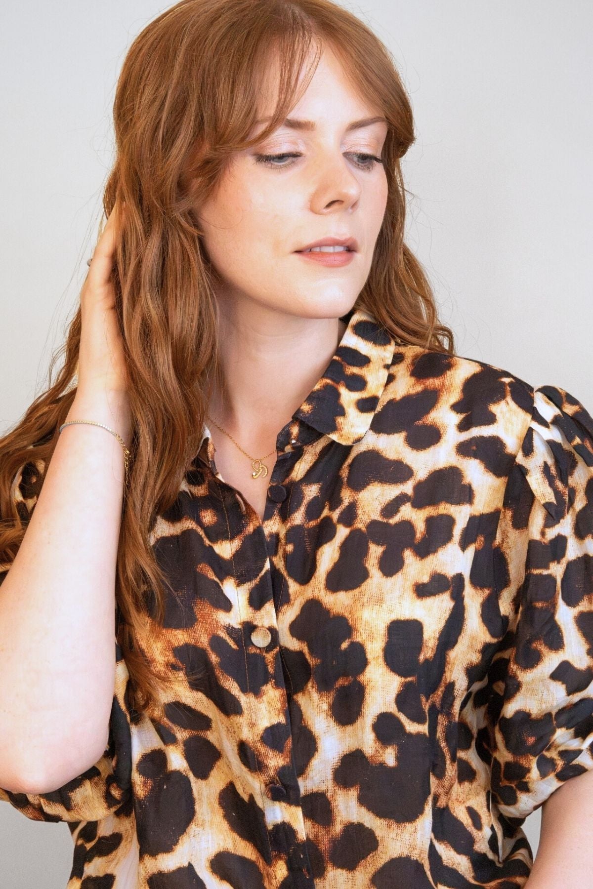 model wears Courage Gold Shorthand Charm Necklace