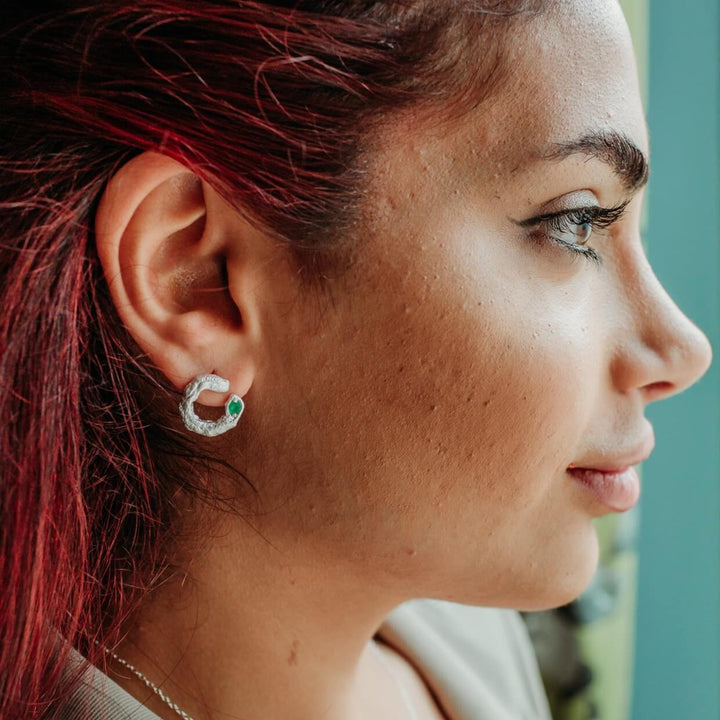 model wears Emerald Silver Asymmetric Open Circle Branch Statement Earrings