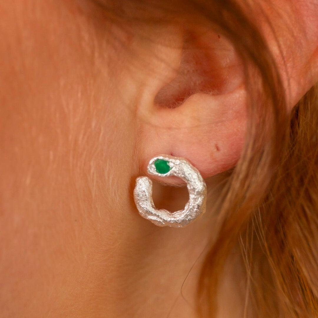 model wears Emerald Silver Asymmetric Open Circle Branch Statement Earrings