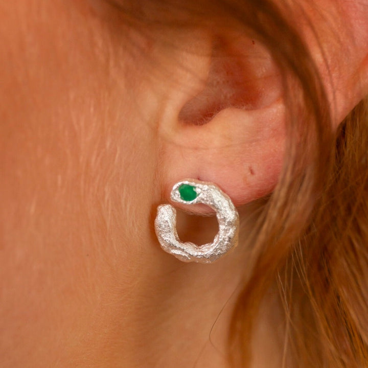 model wears Emerald Silver Asymmetric Open Circle Branch Statement Earrings