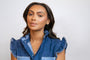 model wears emerald antique huggie hoop earrings