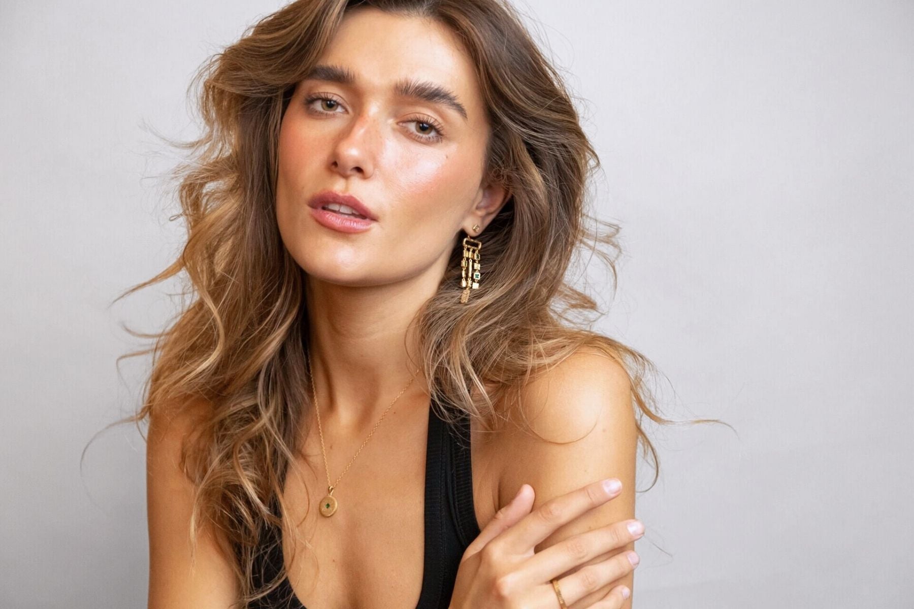 model wears Lovespoon Gold Charm Necklace