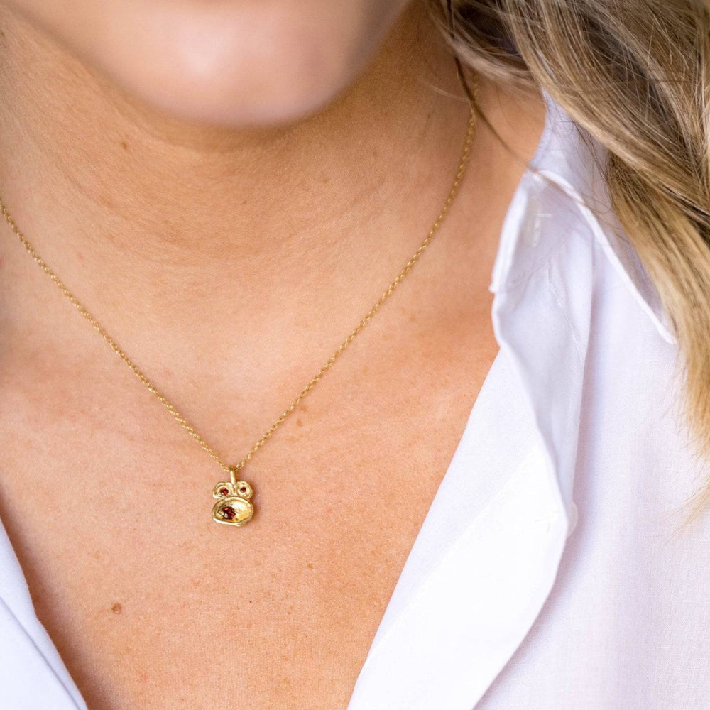 model wears Garnet and Gold Birthstone Pendant Necklace