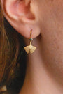 model wears Ginkgo Leaf Gold Earrings close up
