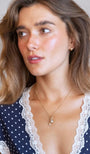 model wears Brushed Gold Chunky Huggie Hoops
