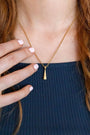 model wears Sparkly Comet Gold Charm Necklace