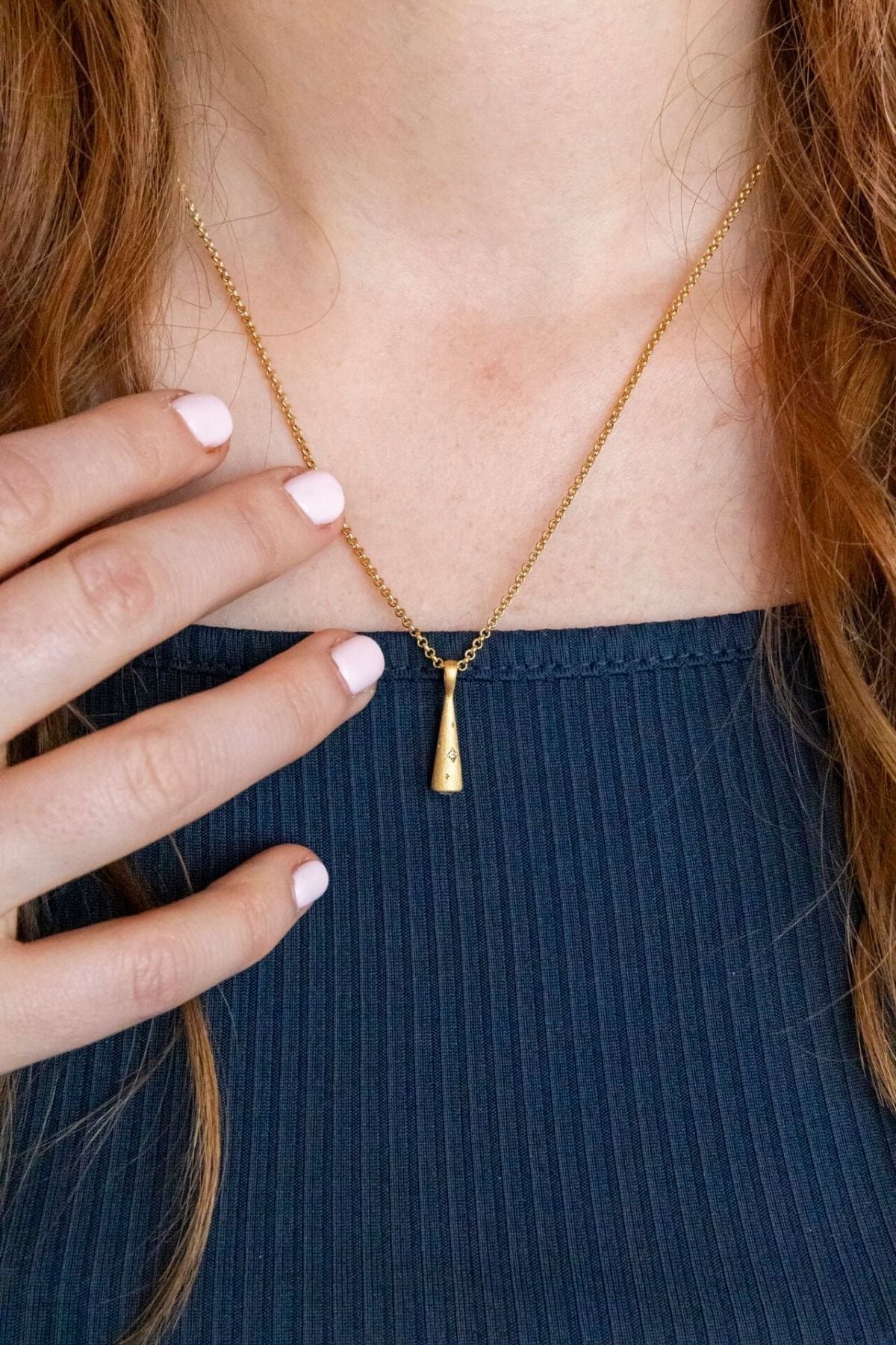 model wears Sparkly Comet Gold Charm Necklace