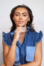 model wears Sparkly Comet Gold Charm Necklace on heart connector chain