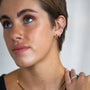 model wears gold ear stack including Moon Yellow Opal Gold Stud Earrings