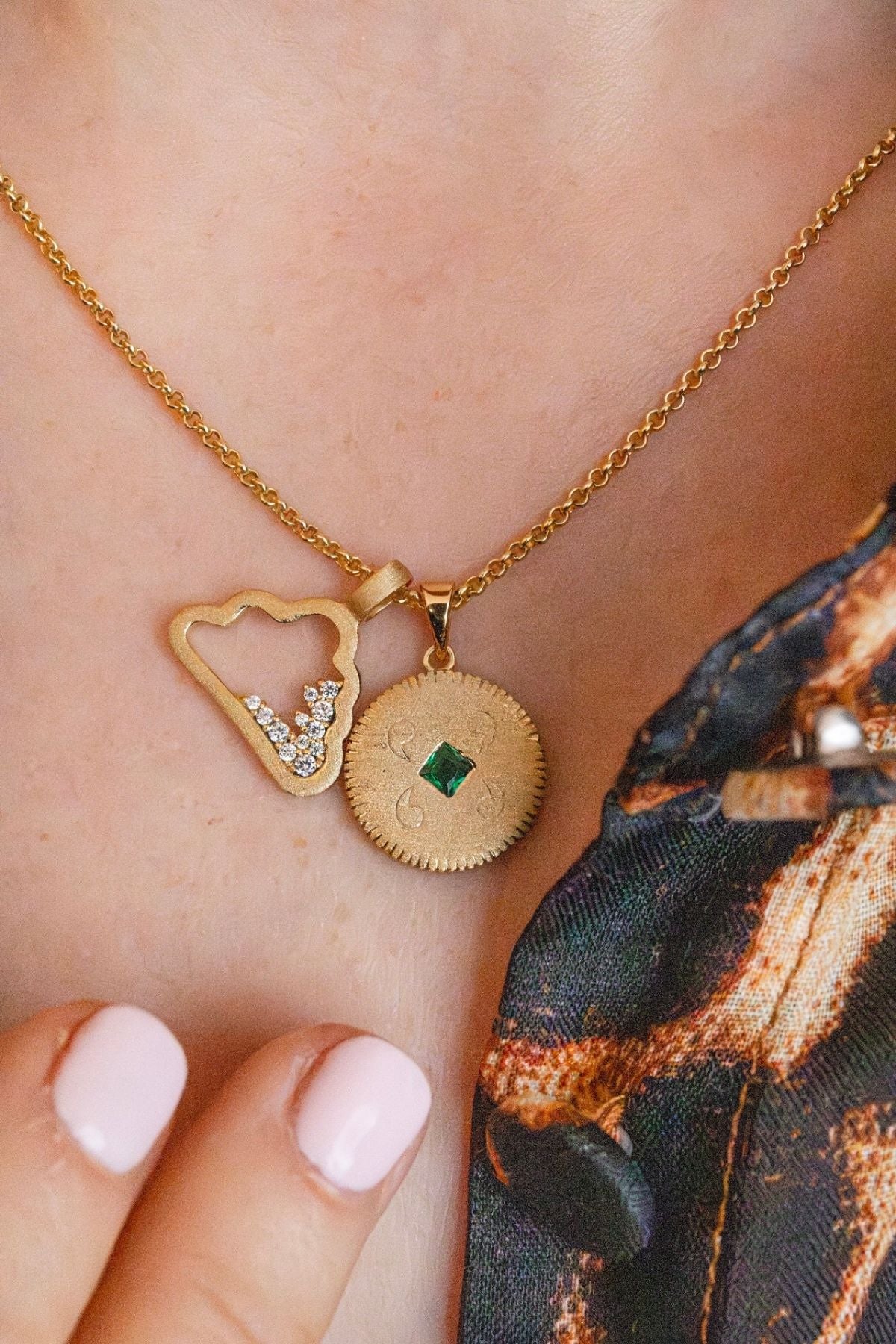 model-wears-gold-lovespoon-charm-and-sparkly-cloud-charm-necklace-
