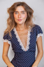 
model wears Sparkly Gold Cloud Charm Necklace an cloud earrings