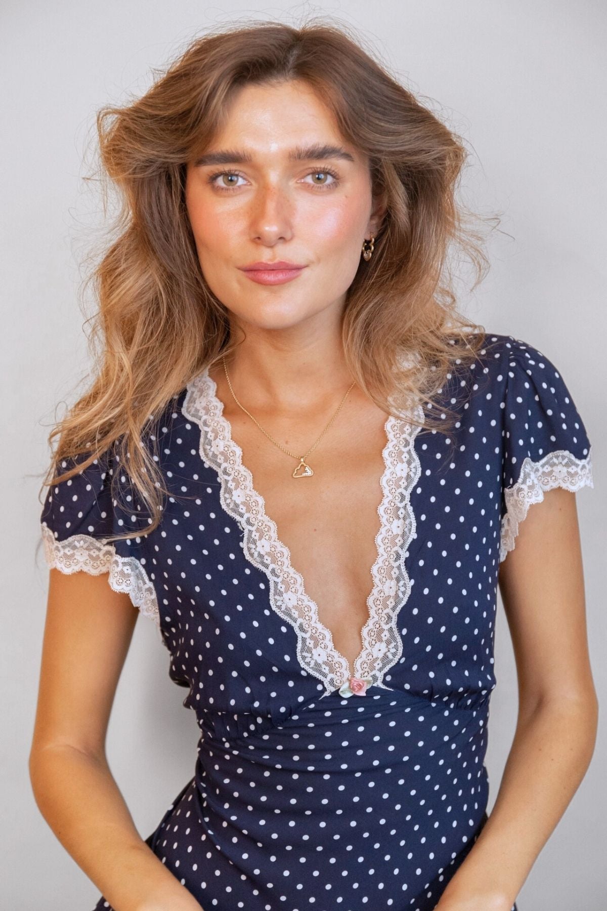 
model wears Sparkly Gold Cloud Charm Necklace an cloud earrings