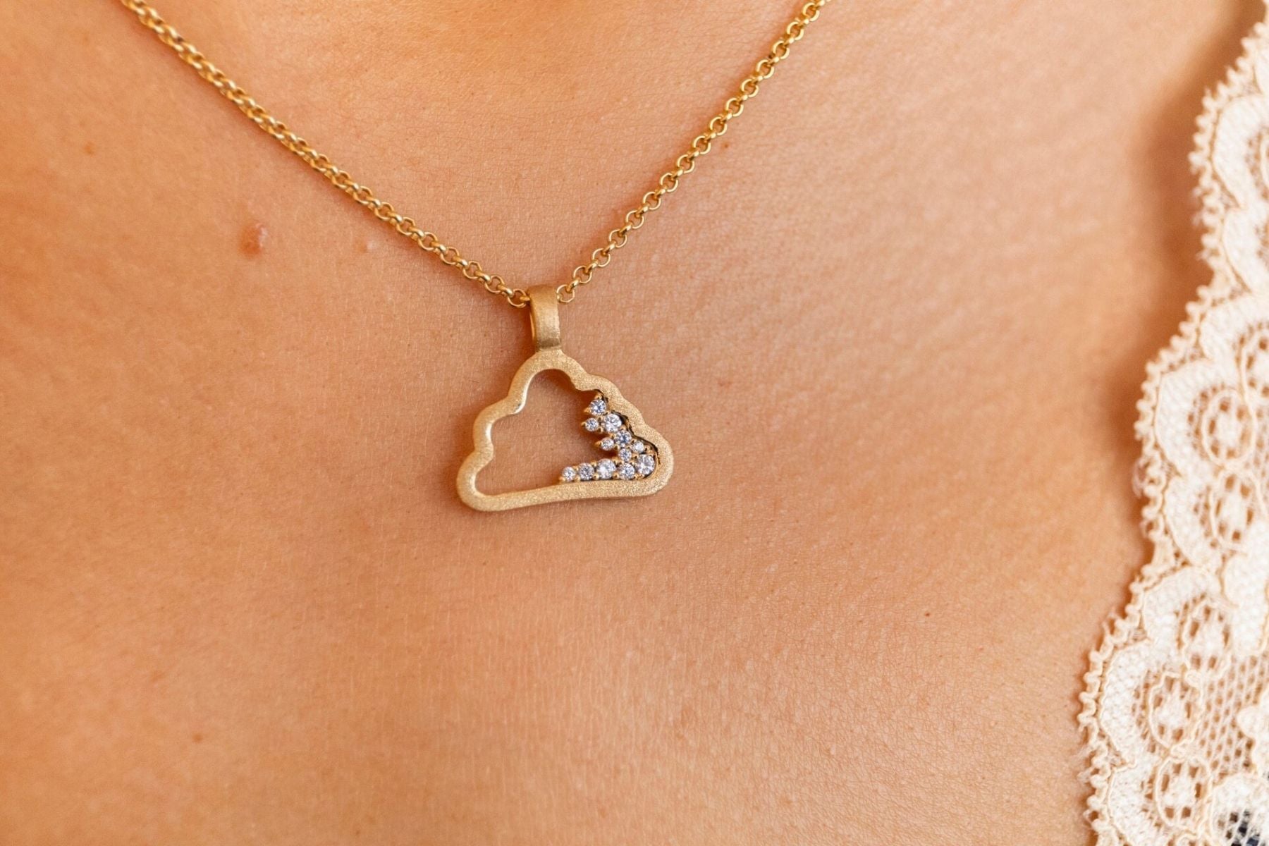 model wears Sparkly Gold Cloud Charm Necklace - close up