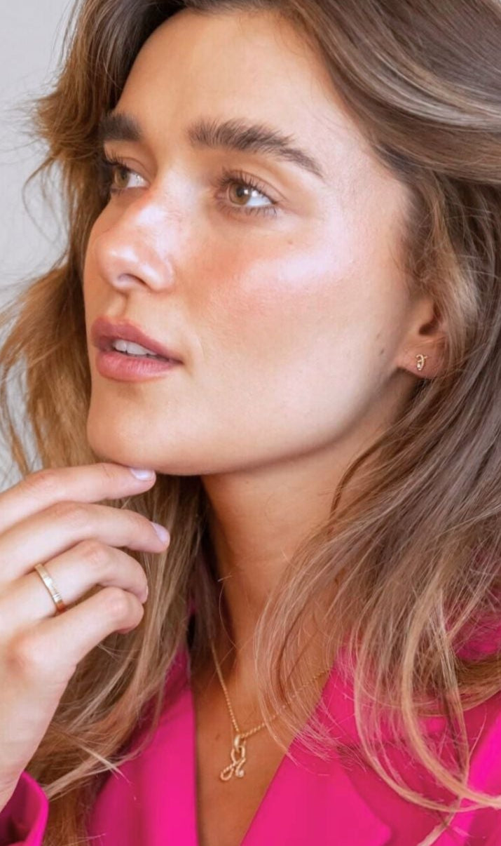 model wears Great Gold Shorthand Stud Earring