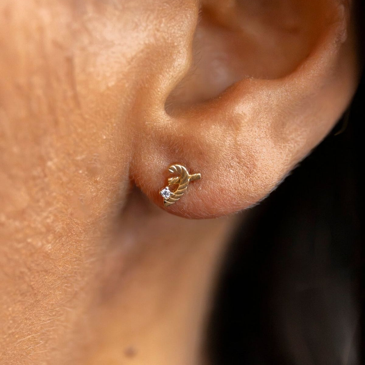 model wears Great Gold Shorthand Stud Earring
