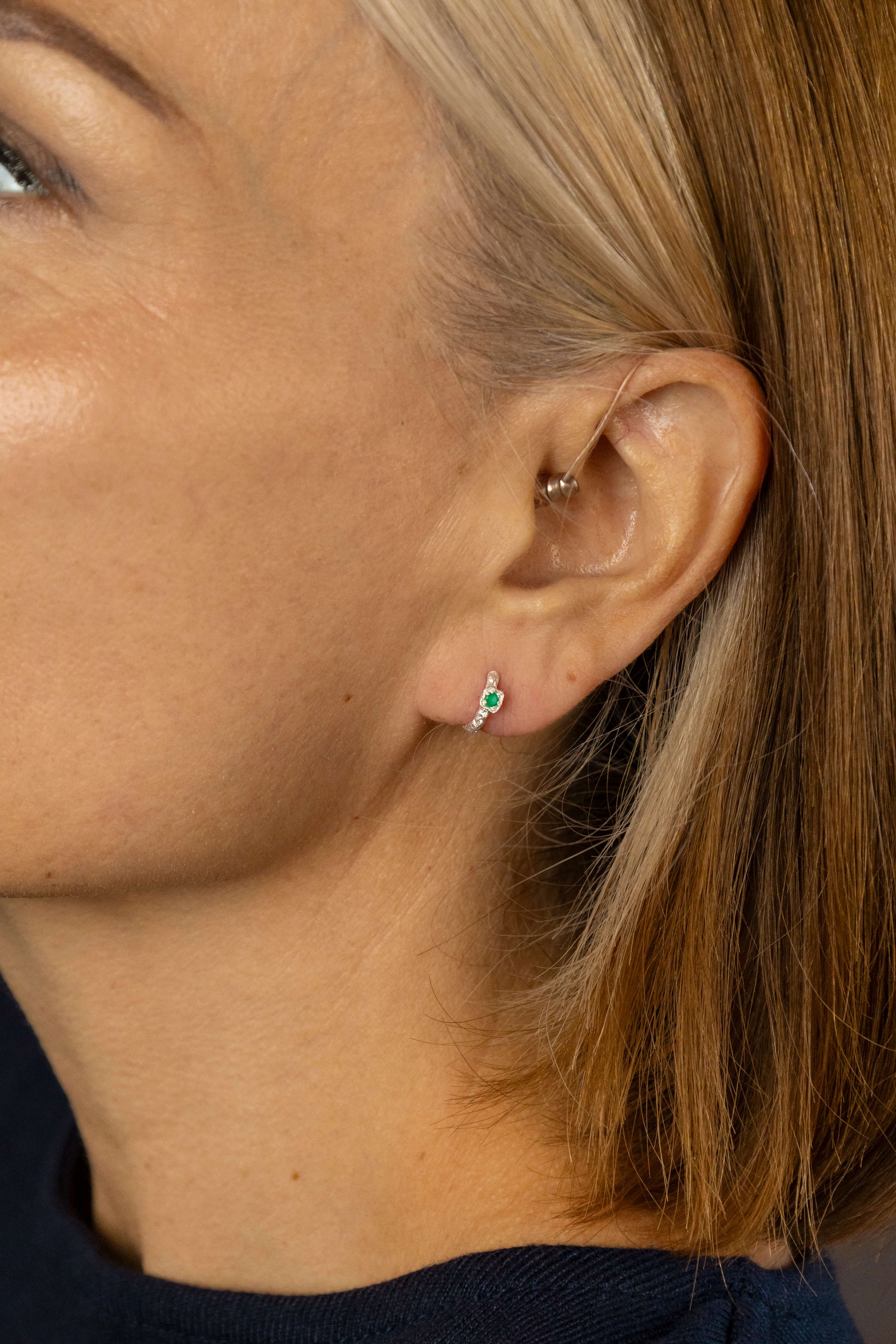 model wears Chalcedony Lichen Branch silver Huggies