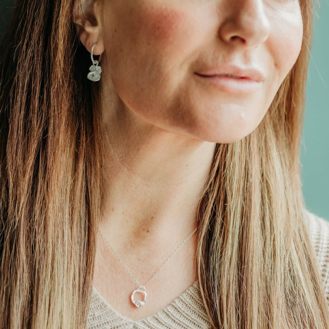 model wears Lab Grown Diamond Silver Eternity Necklace - Small  and lab grown diamond hoop earrings