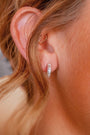 model wears Diamond Art Deco Silver Huggie Earrings