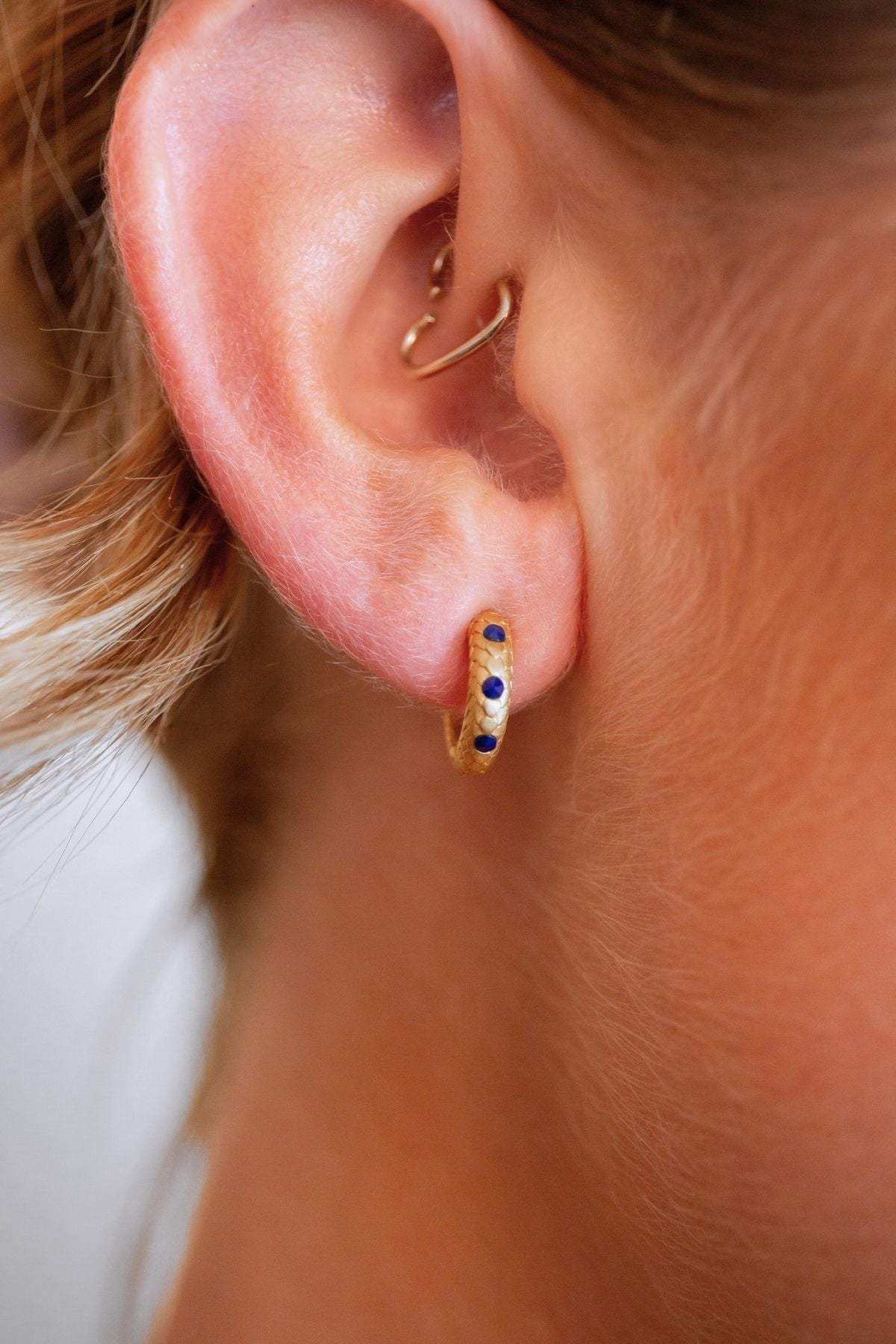 model wears Art Deco Lapis Lazuli Gold Huggie Earrings
