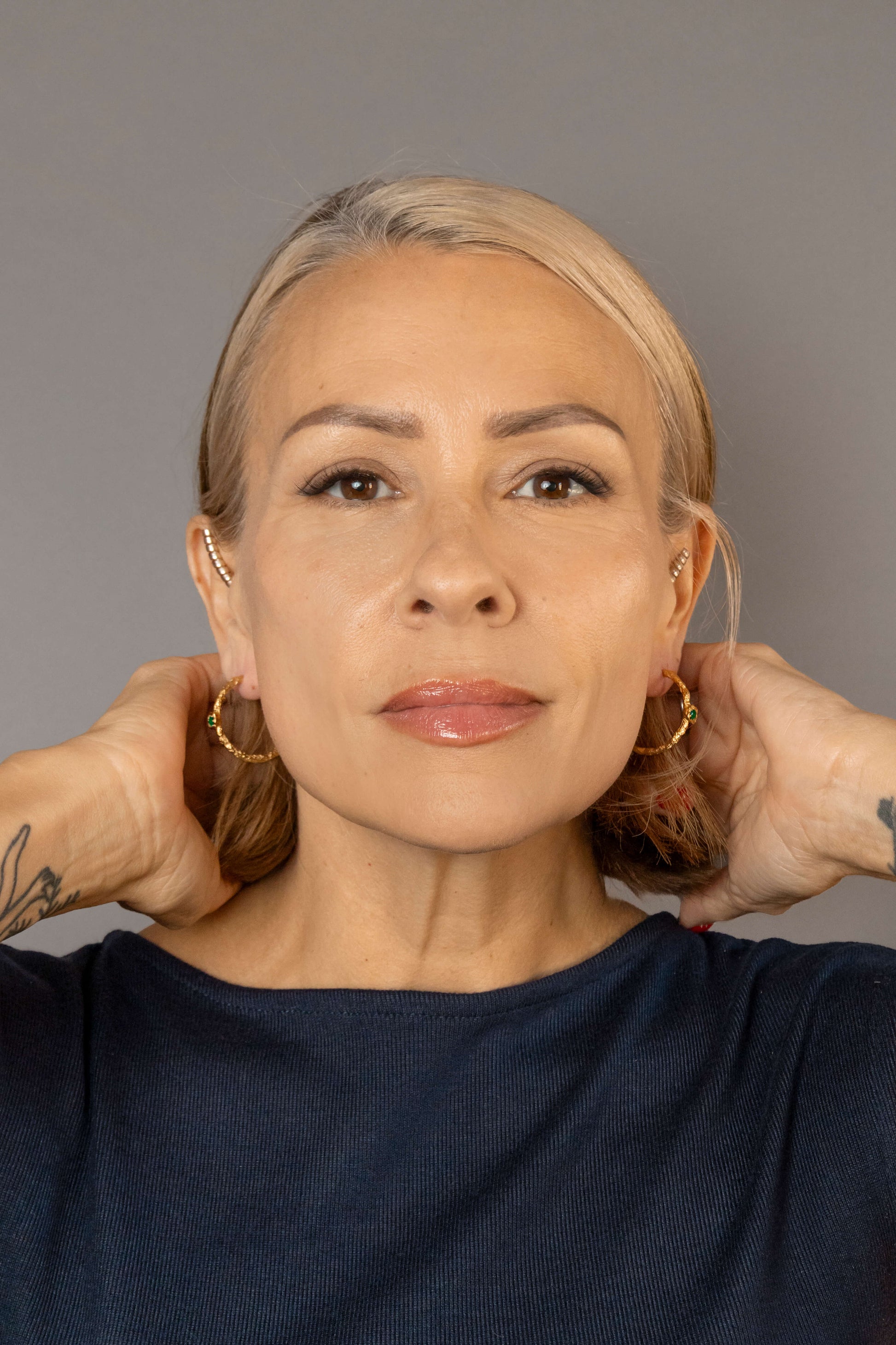 model wears Chalcedony Lichen Branch Gold Large Hoops