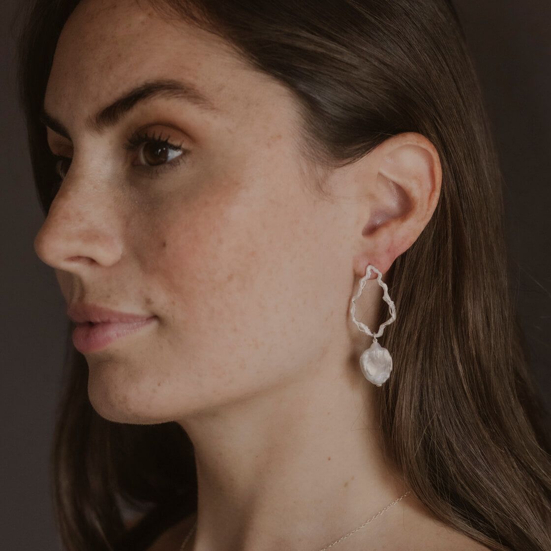 model wears Pearl Silver Branch Drop Earrings