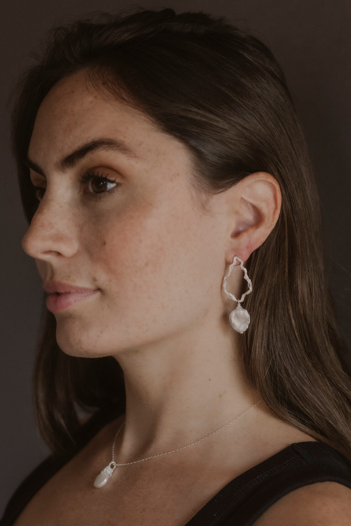 model wears Pearl Silver Branch Drop Earrings