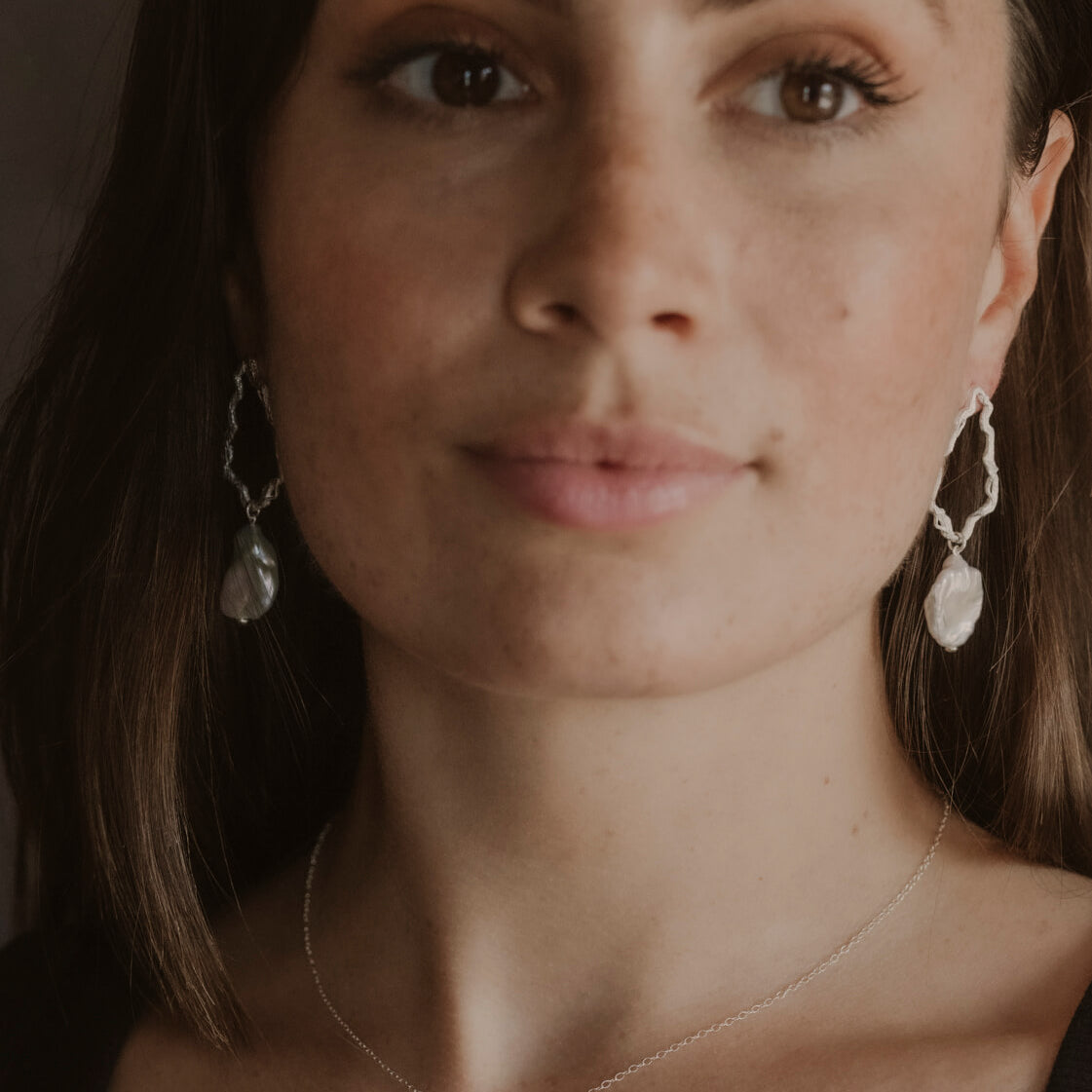 model wears Pearl Silver Lichen Pendant Necklace and pearl silver drop earrings 