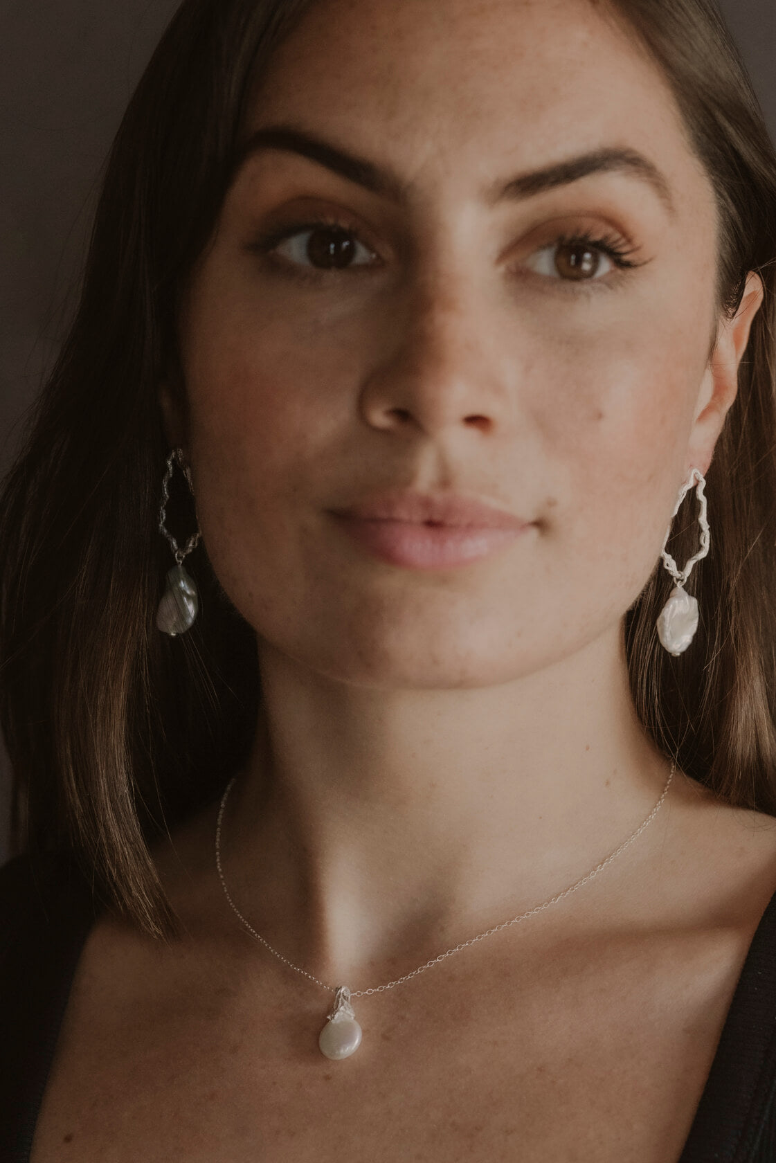 model wears Pearl Silver Lichen Pendant Necklace and pearl silver drop earrings 
