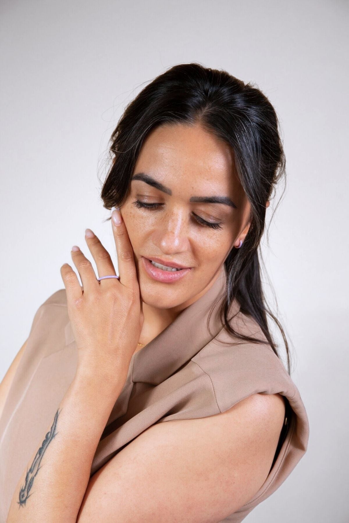 model wears lavender enamel huggie hoops and lavender enamel ring 
