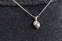 model wears silver lemon charm necklace
