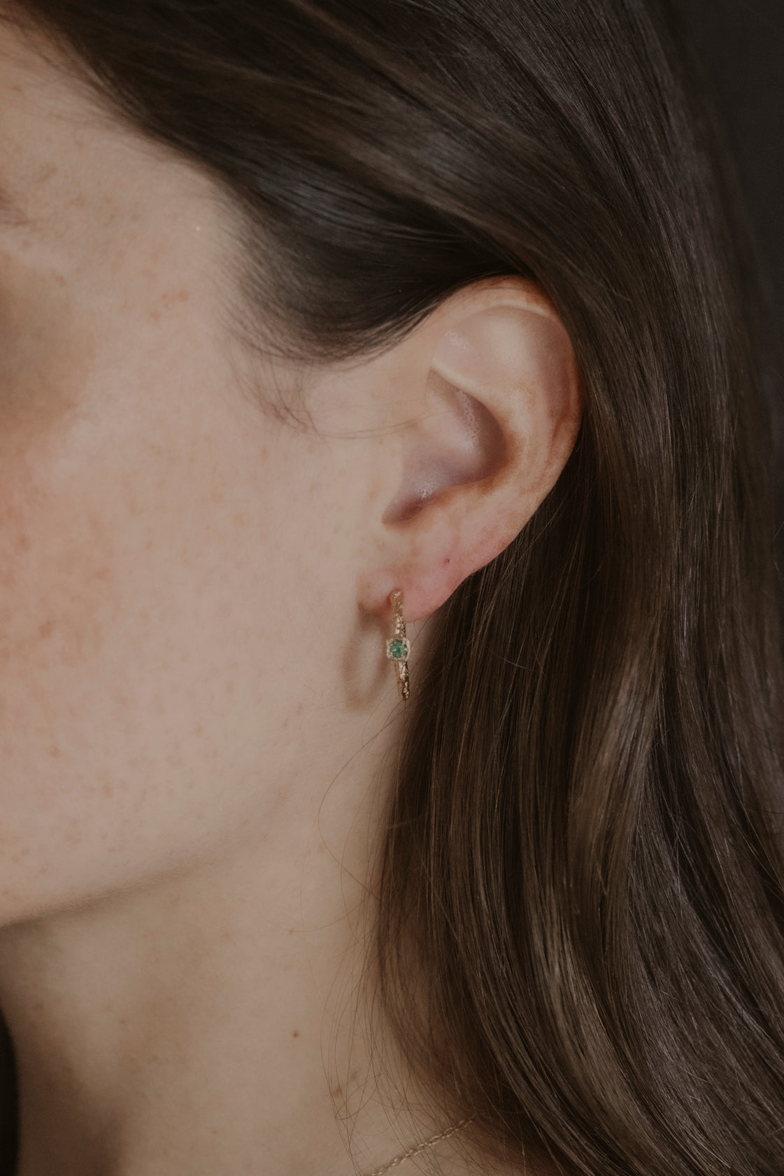 model wears Chalcedony Lichen Branch Gold Medium Hoops