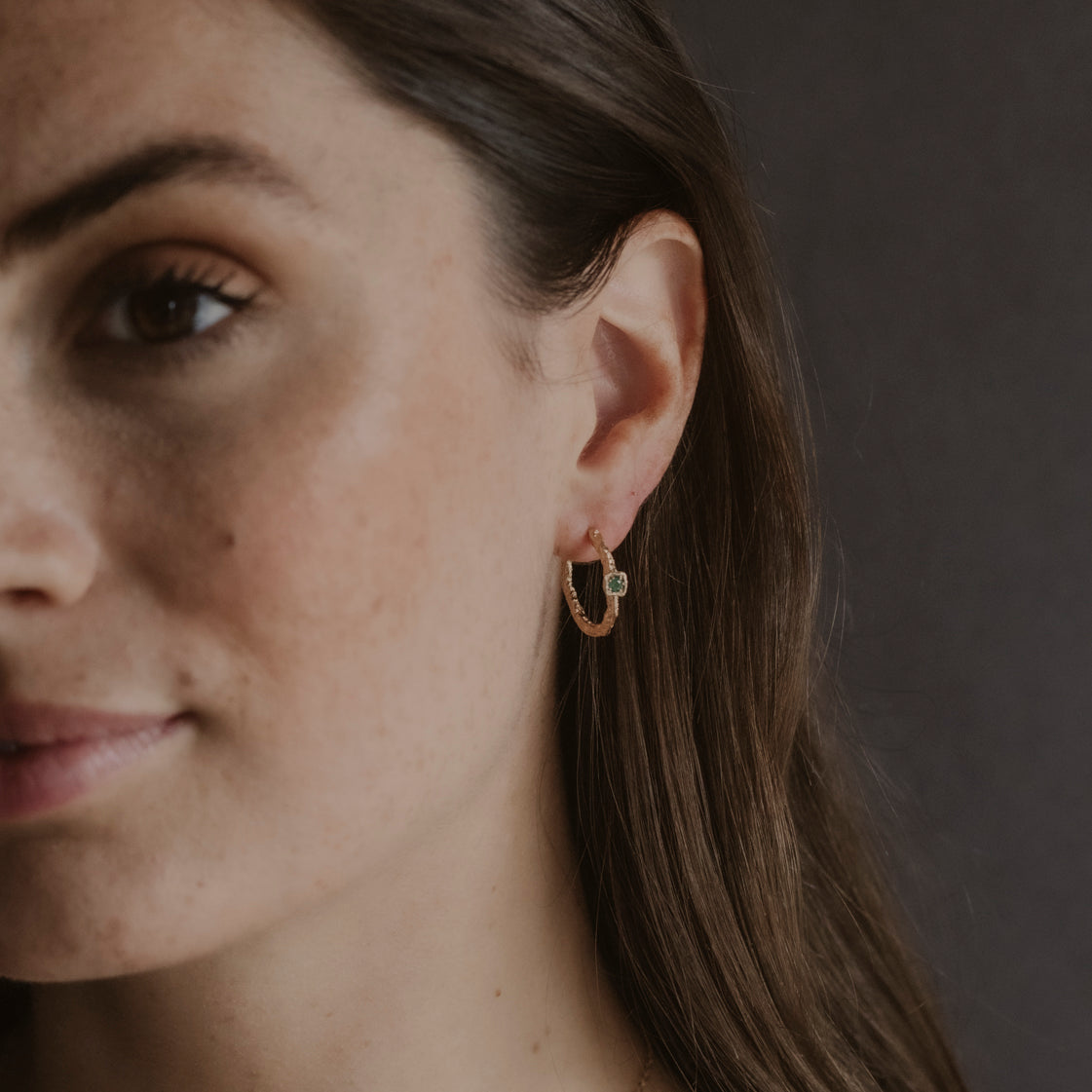 model wears Chalcedony Lichen Branch Gold Medium Hoops
