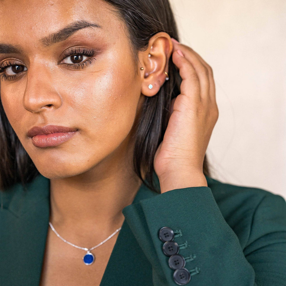 model wears Moon Yellow Opal Silver Stud Earrings