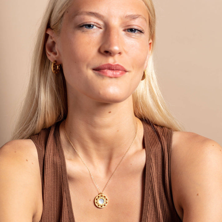 model wears Mother of Pearl and Gold Geometric Disc Necklace