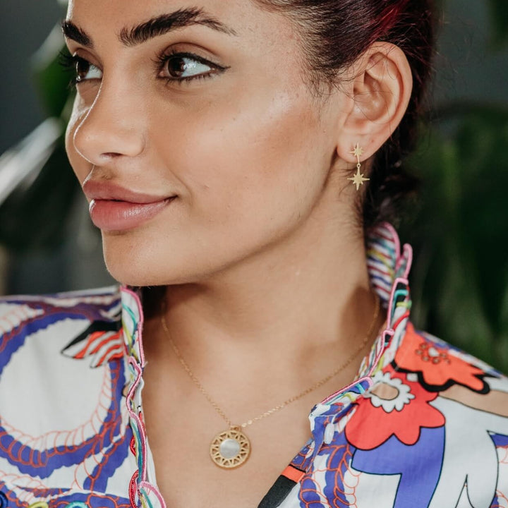 model wears Mother of Pearl and Gold Geometric Disc Necklace