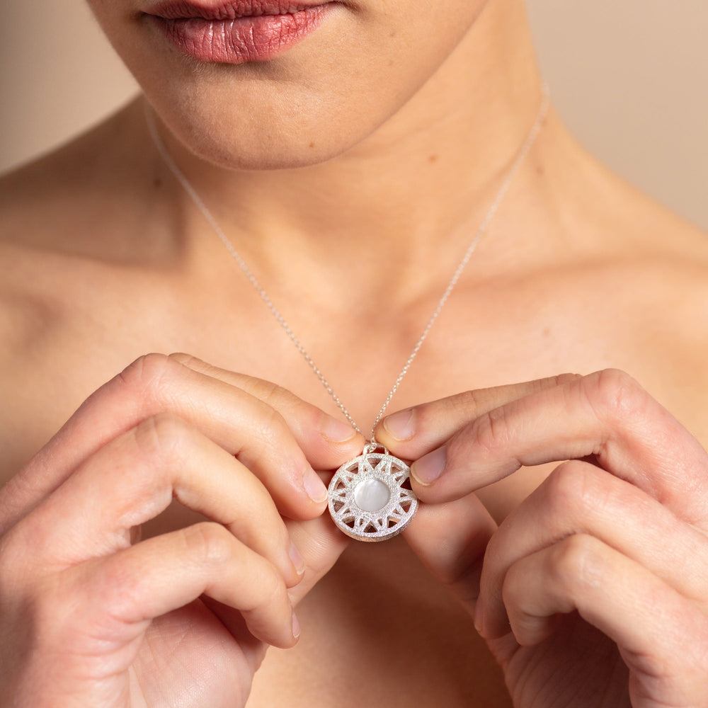 model wears Mother of Pearl and Silver Geometric Disc Necklace