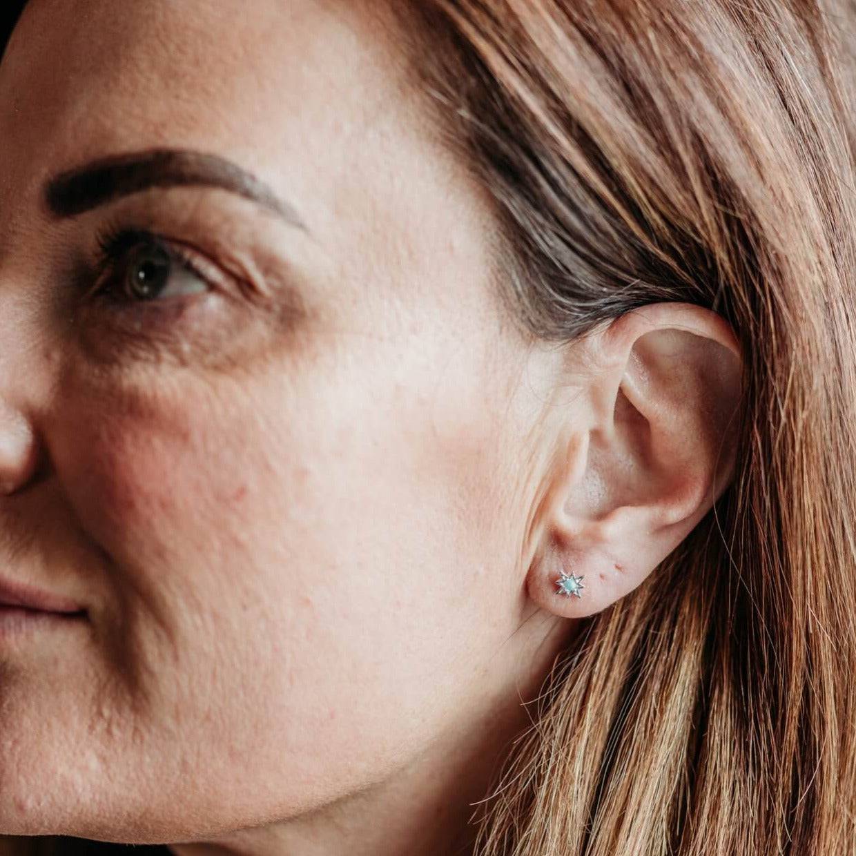 model wears Opal Silver Star Mini Stud Earrings