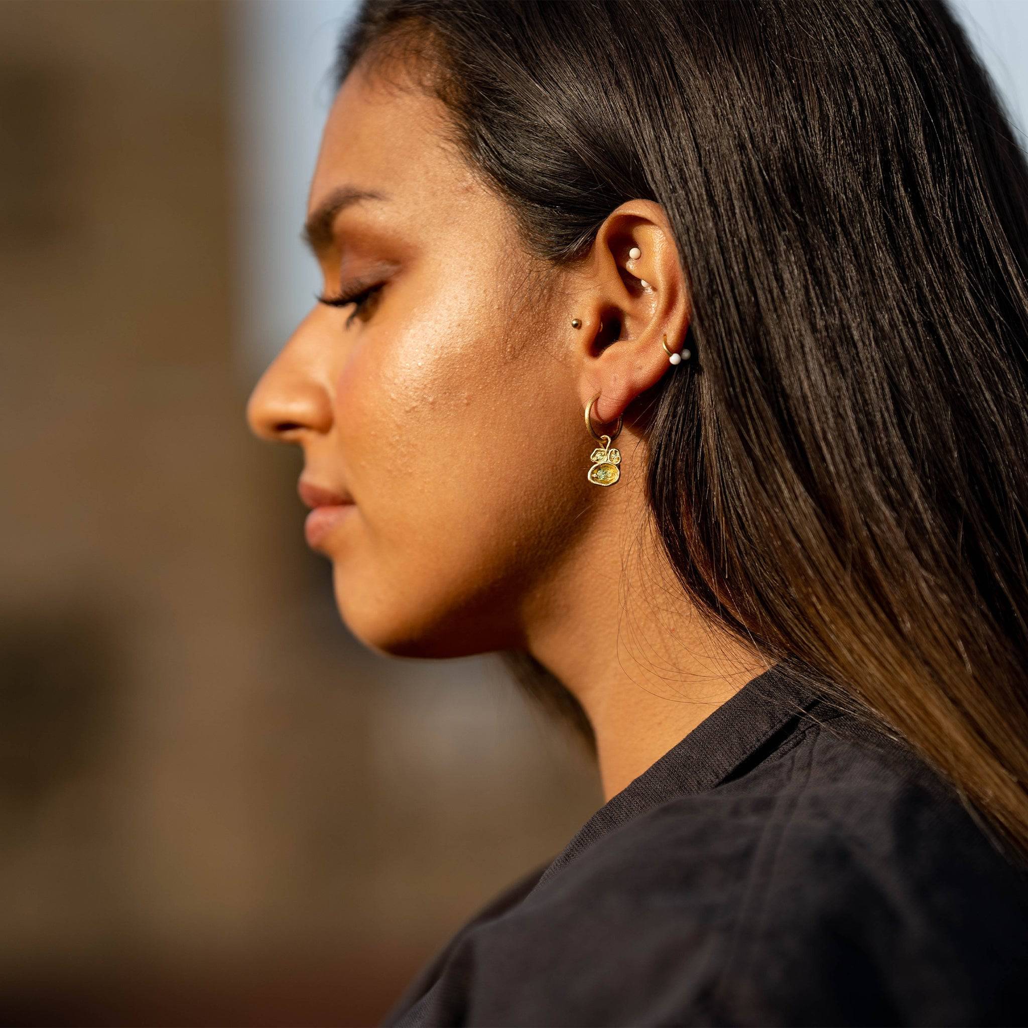 model wears Peridot and Gold Vermeil Lichen Birthstone Hoop Earrings