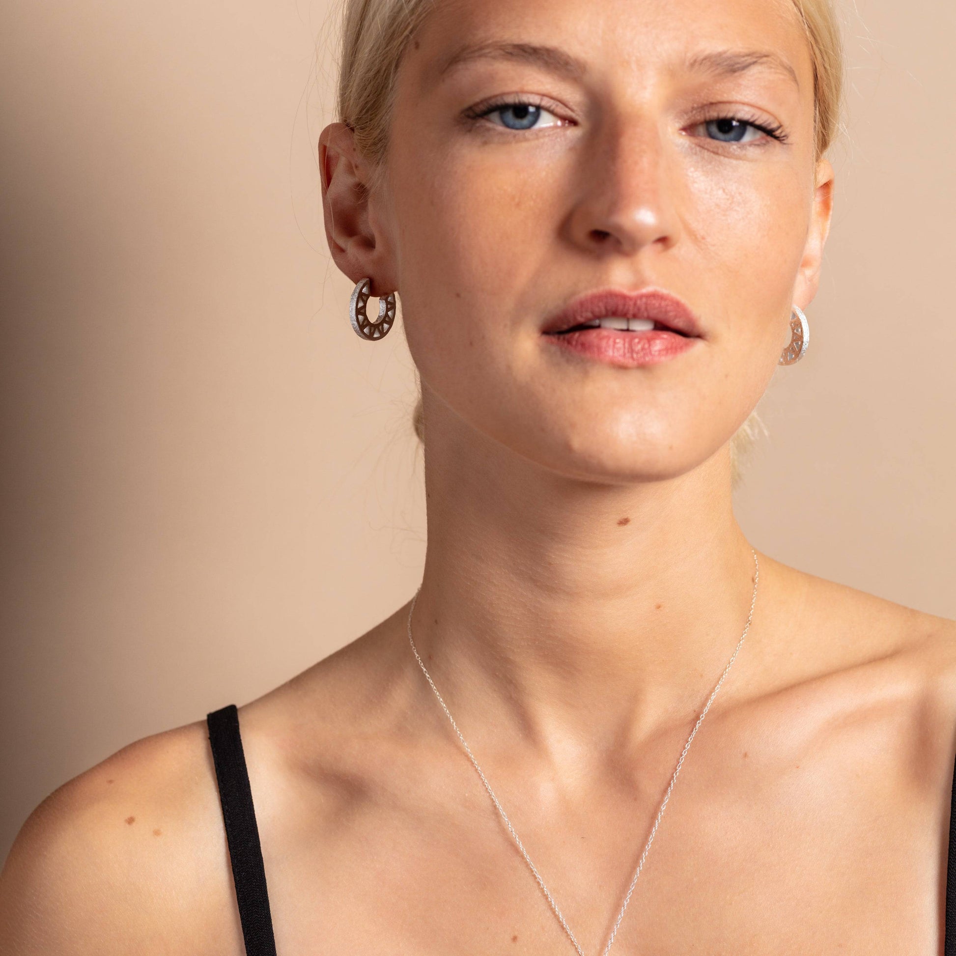 model wears Geometric Silver Hoop Earrings
