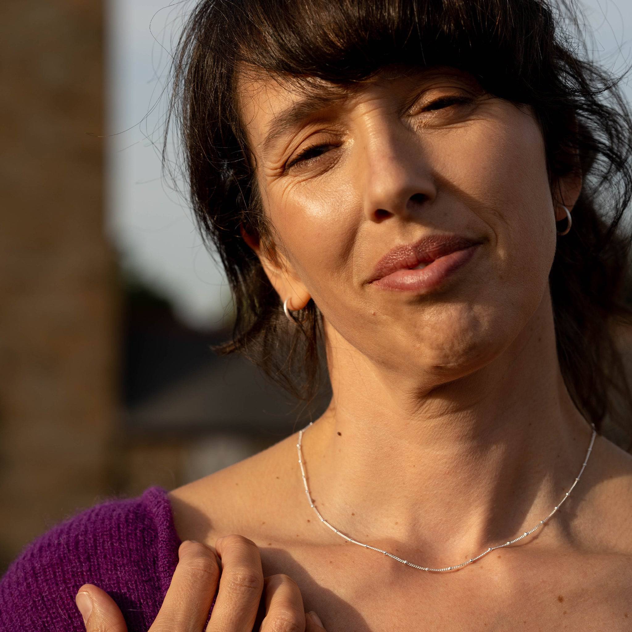 model wears Satellite Beaded Silver Chain Necklace