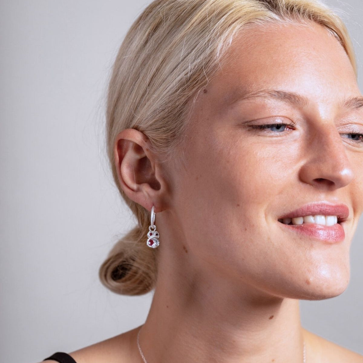 model wears Ruby Silver Lichen Hoop Earrings