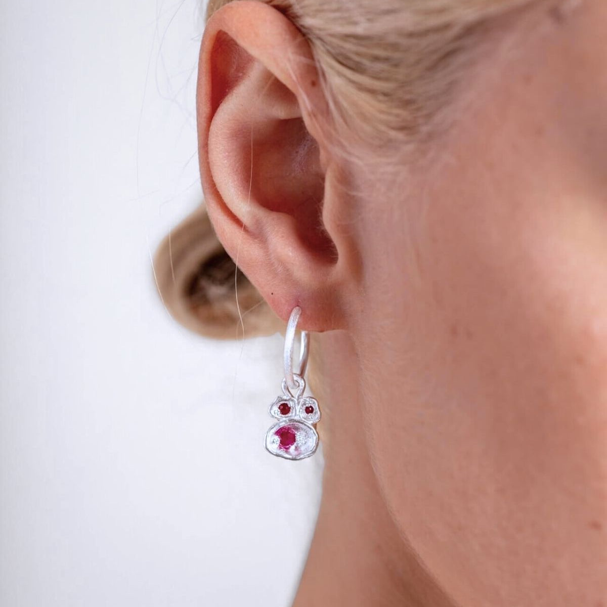 model wears Ruby Silver Lichen Hoop Earrings