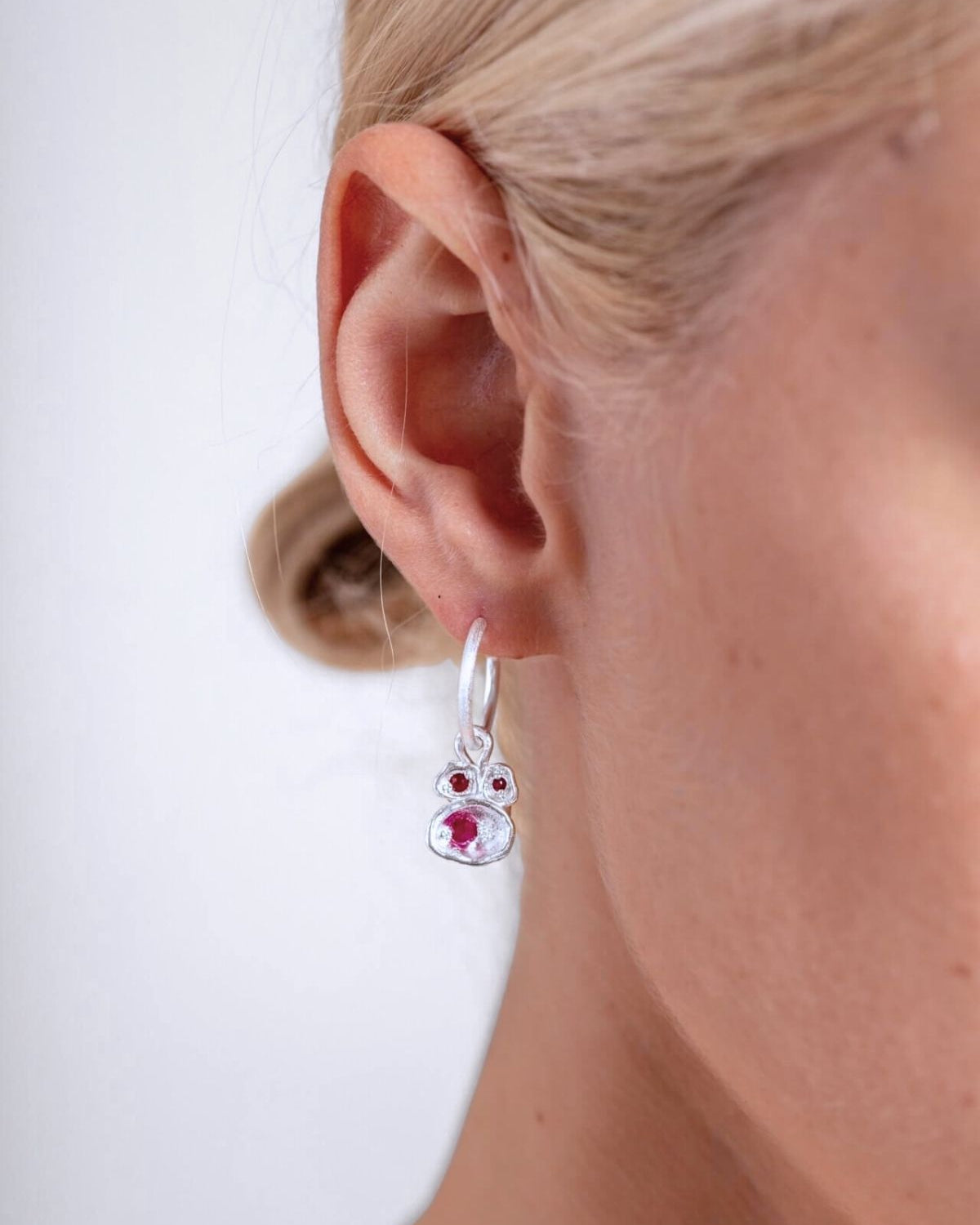 model wears Ruby Silver Lichen Hoop Earrings
