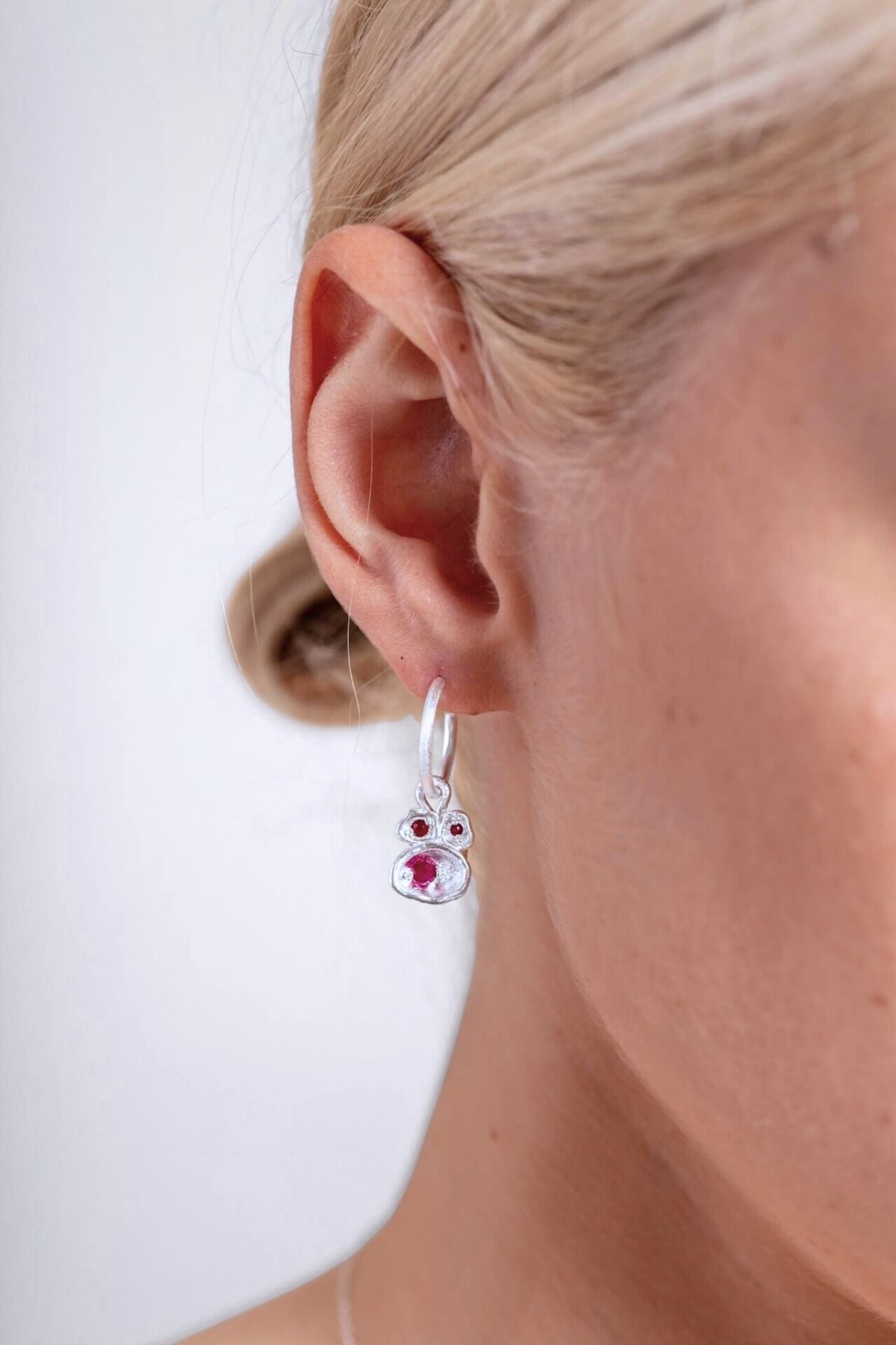 model wears Ruby Silver Lichen Hoop Earrings